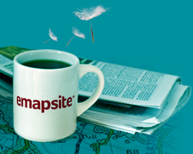 emapsite logo on mug next to newspaper