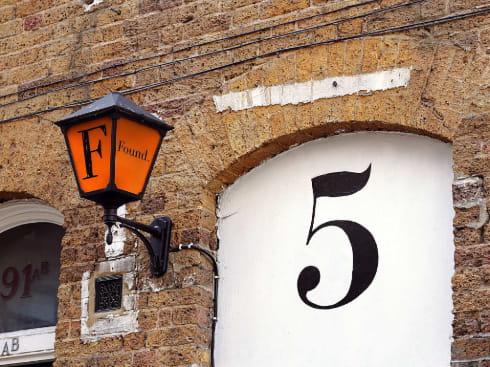 Old street lamp that says 'Found'